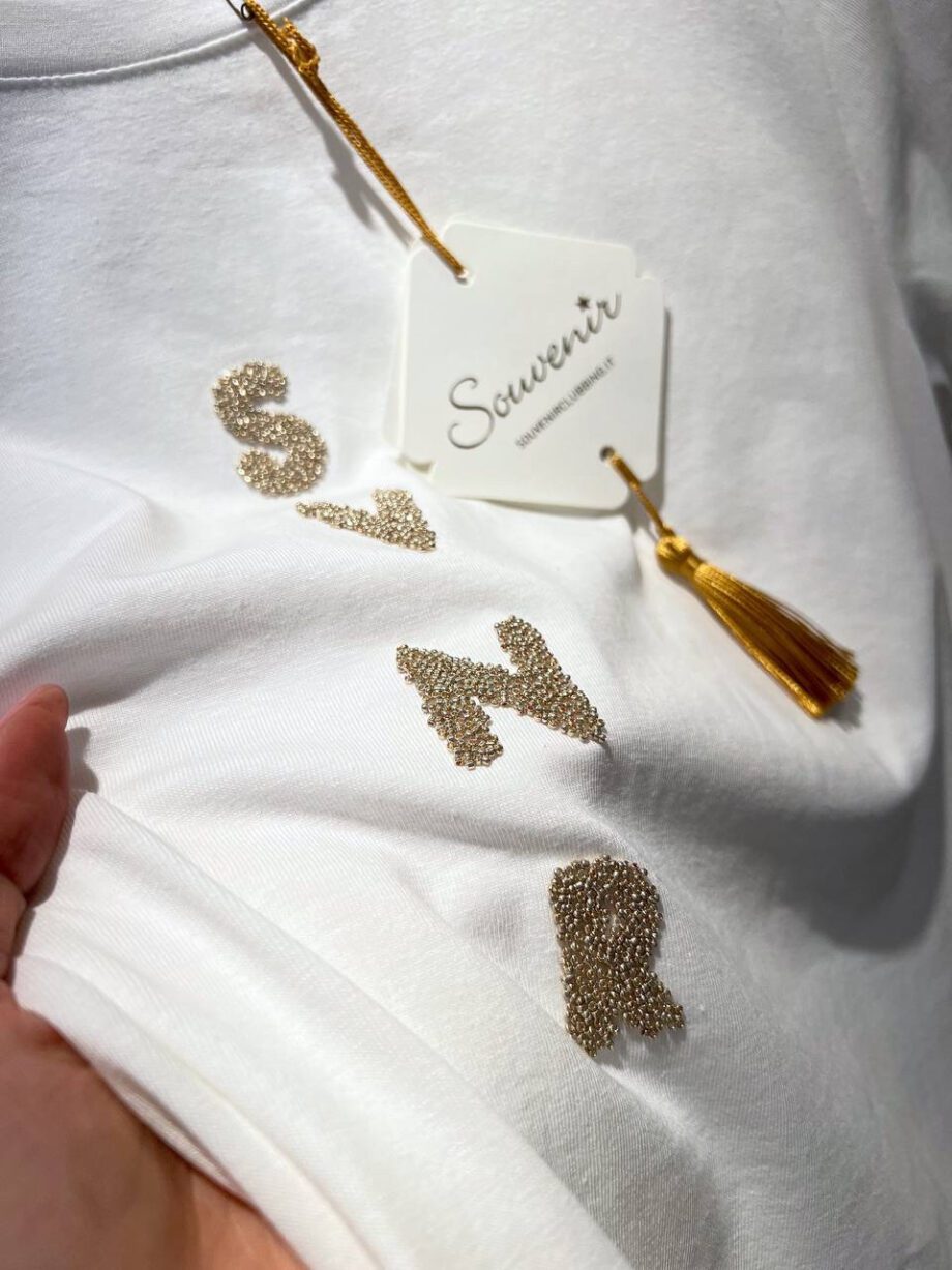 Shop Online T-shirt bianca con scritta strass oro Souvenir