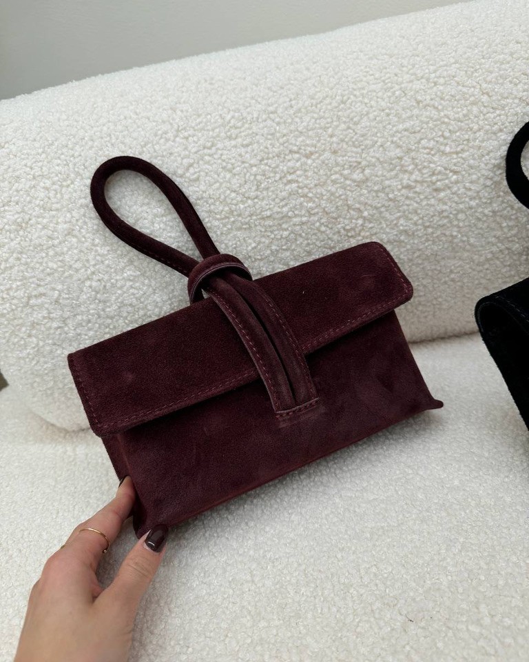 Pochette bordeaux in camoscio con manico intrecciato Shop Online Pochette bordeaux in camoscio con manico intrecciato