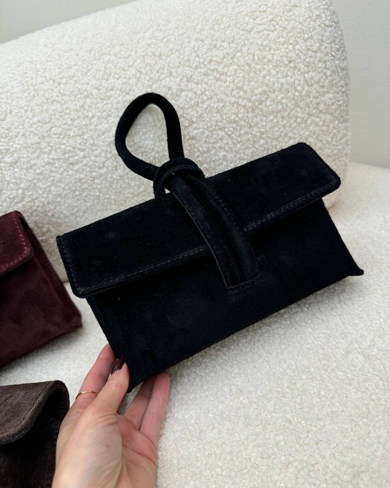 Pochette nera in camoscio con manico intrecciato Shop Online Pochette nera in camoscio con manico intrecciato