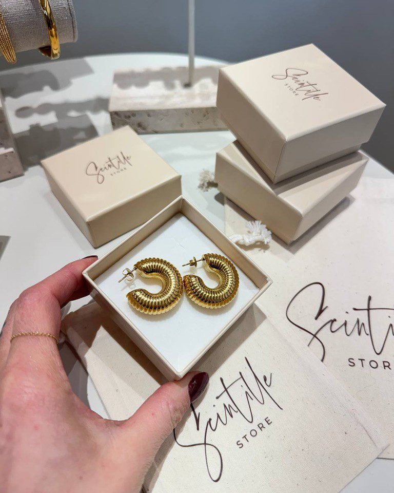 Orecchini a campanella rigati dorati Shop Online Orecchini a campanella rigati dorati